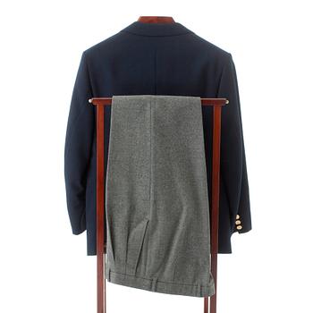 GÖTRICH, a dark blue club blazer and grey wool pants.