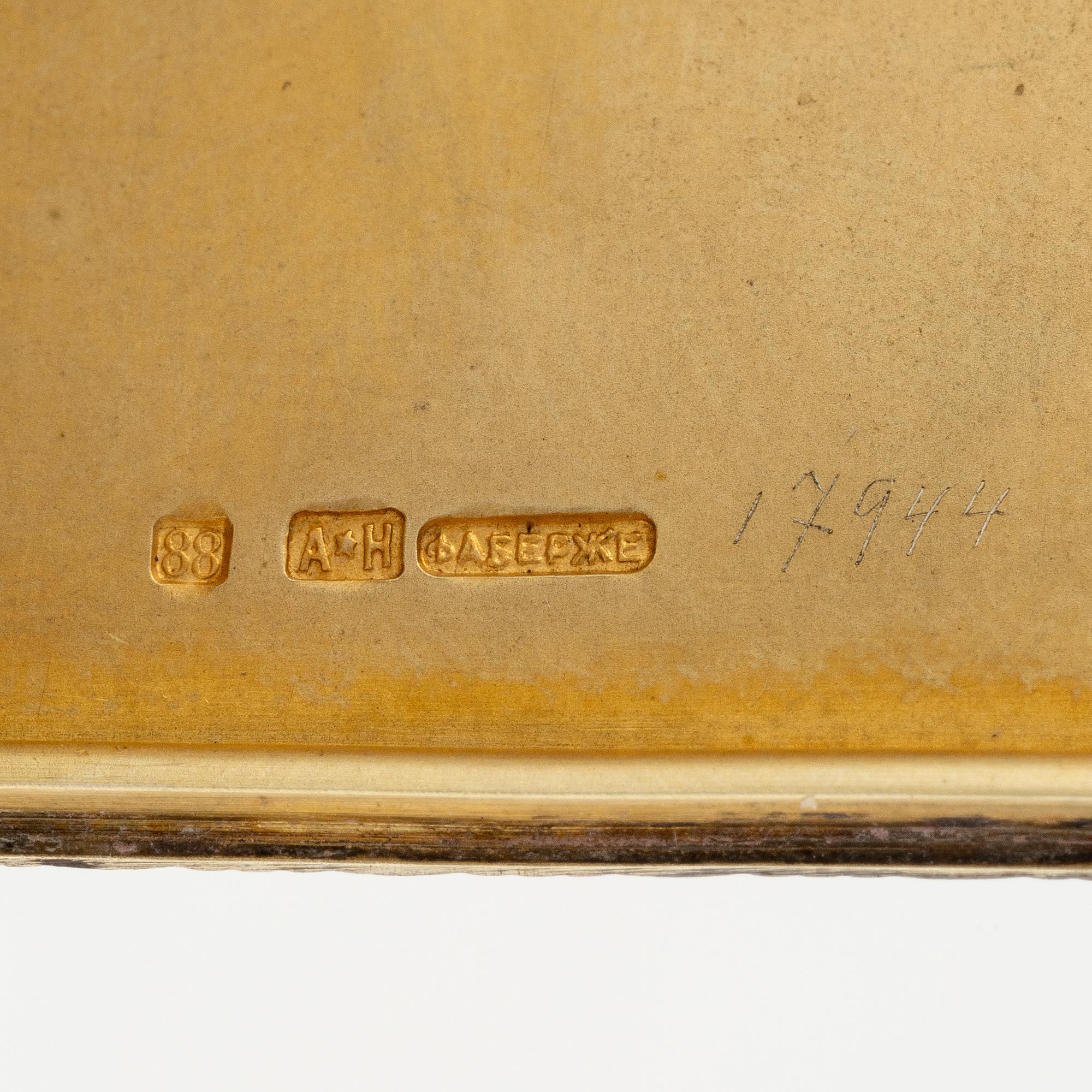 A Silver-gilt Fabergé Cigarette and Match Case, workmaster August Frederik Hollming, St. Petersburg 1908-1917.