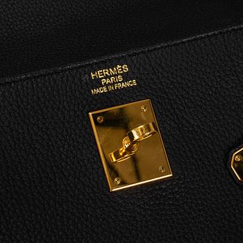 HERMÈS, a 'Kelly 35' black leather bag.