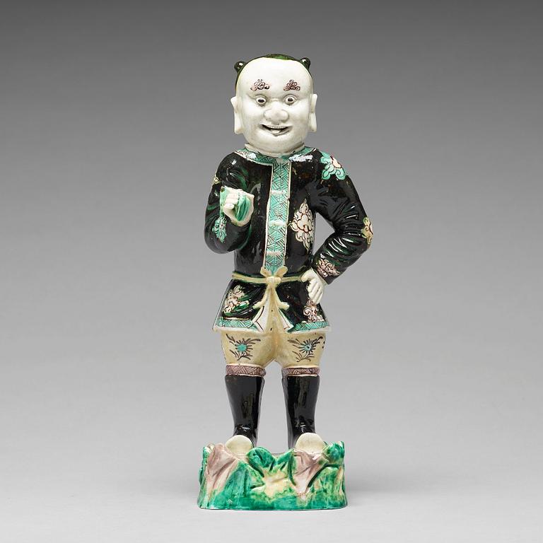 A famille noir figure of a man, Qing dynasty, Kangxi (1662-1722).