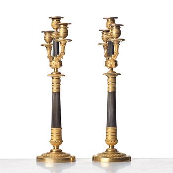 A pair of French Empire three-light candelabra, early 19th century.