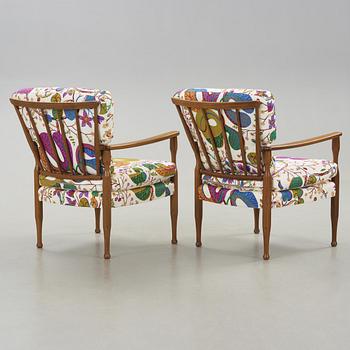 A pair of Josef Frank mahogany armchairs for Svenskt Tenn, model 891.
