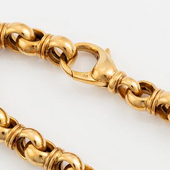 An 18K gold Tännler bracelet.