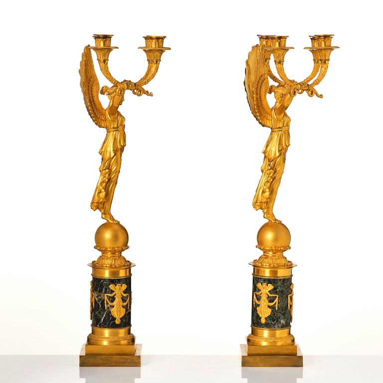 A pair of French Empire four-light candelabra, attributed to Francois Rabiat (bronze maker in Paris 1756-1815).