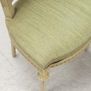 A Gustavian dining table with six chairs. Åmells dated 1974.