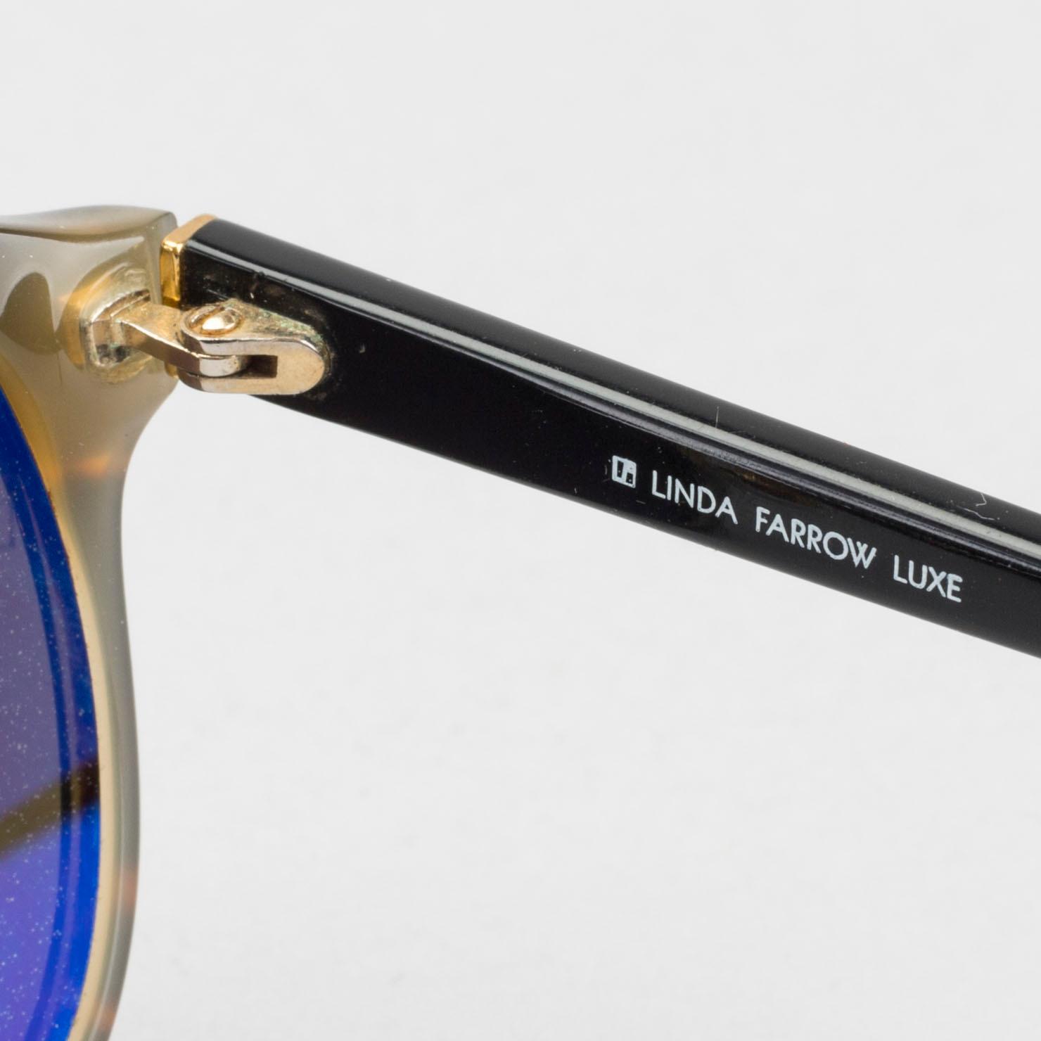 Sunglasses by LINDA FARROW LUXE.
