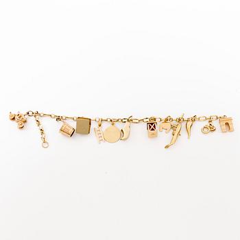 ARMBAND, 18k guld variant på ankarlänk med 11 berlocker (14k och 18k guld). Vikt 16g.