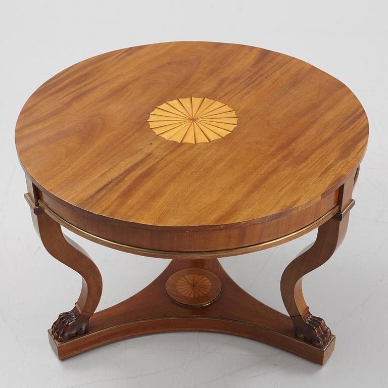 A mahogany veneered Empire style table, first half the 20th Century.