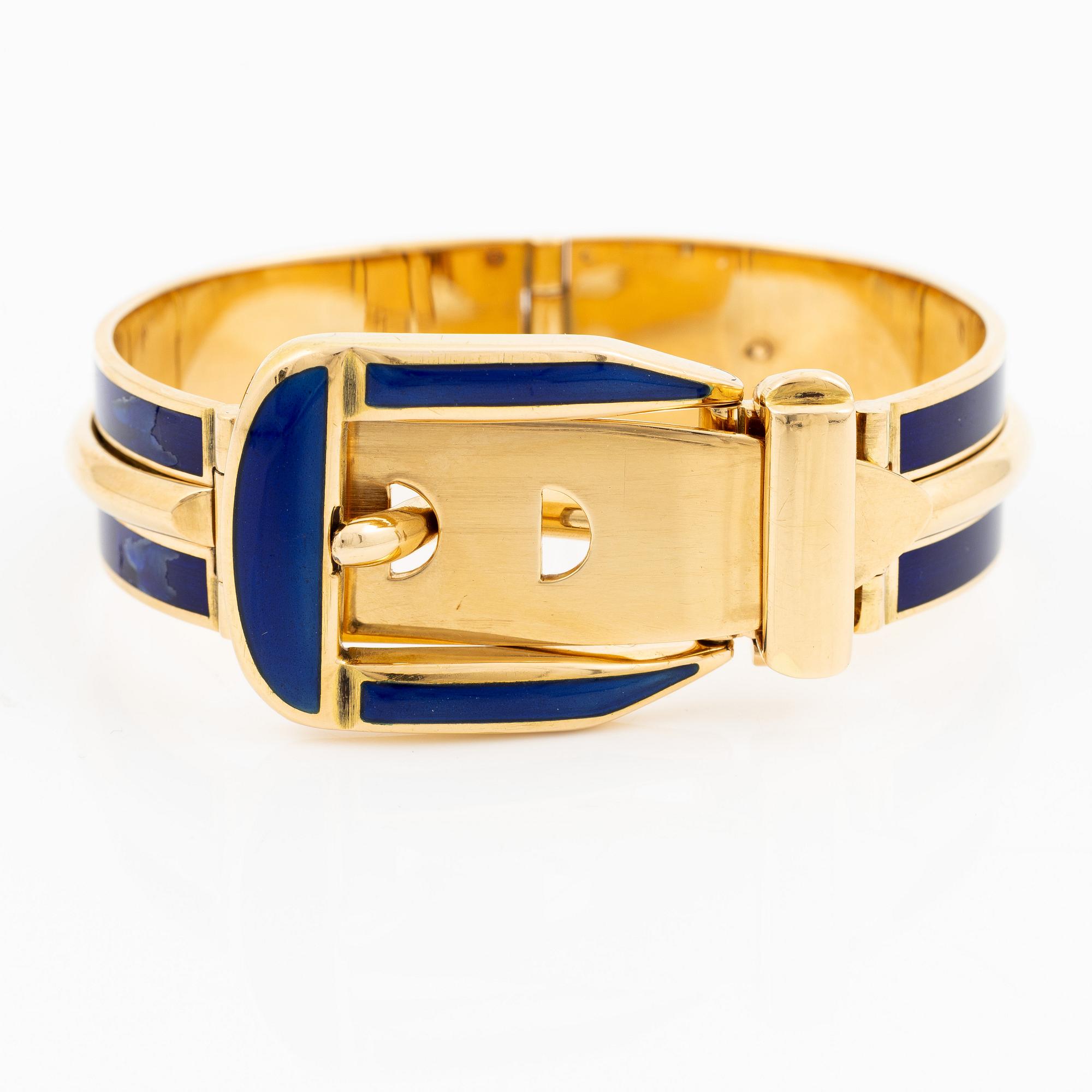 A Gucci bracelet 18K gold with blue enamel.