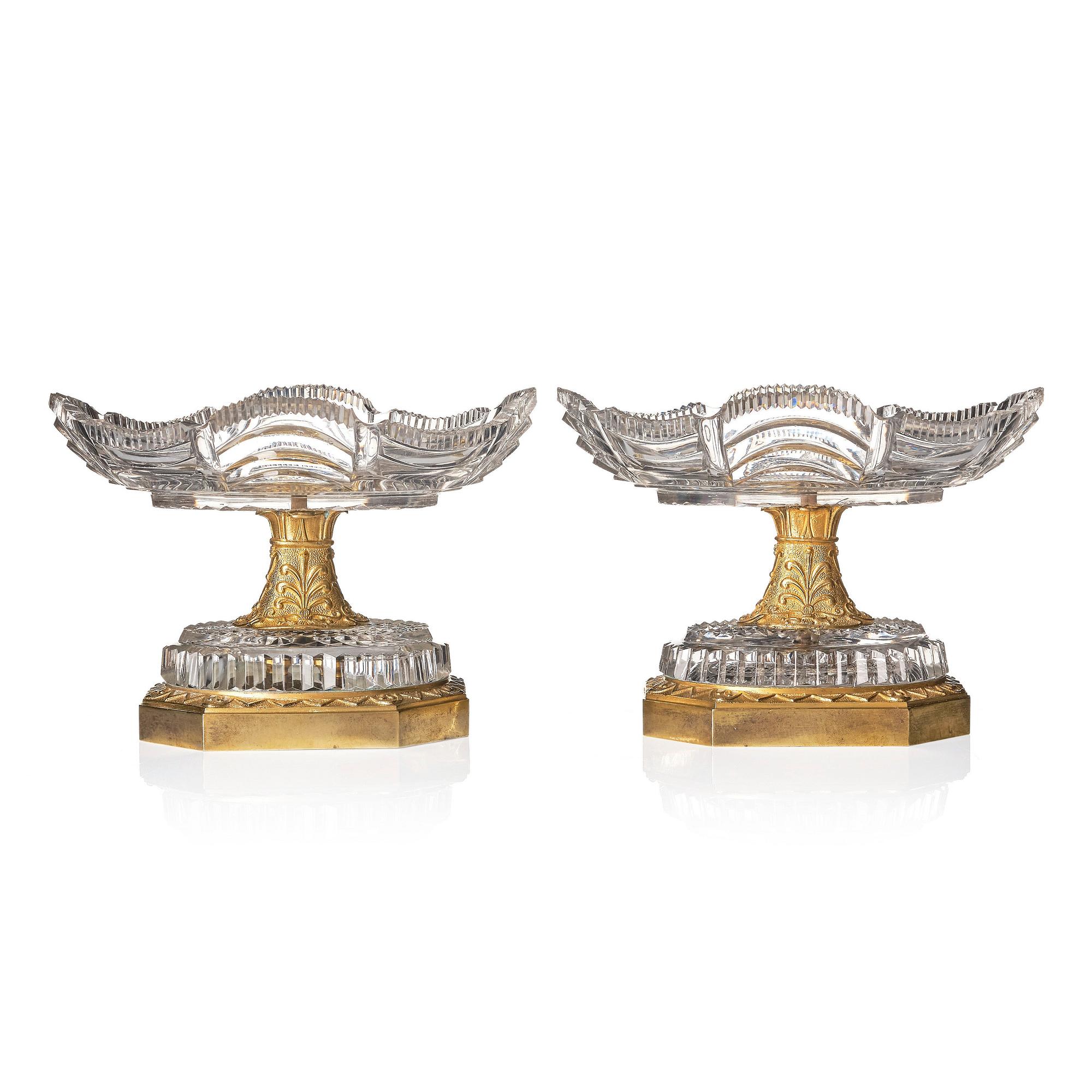 A pair of French Empire early 19th century gilt bronze and glass centre pieces.