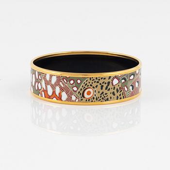 Hermès, an enamel and gold plated metal bangle.