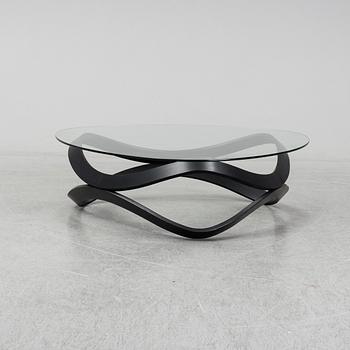 a "Newton" coffee table designed by Dan Sunaga & Staffan Holm in 2009.