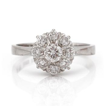 A 0.61 ct brilliant cut carmosé diamond ring.