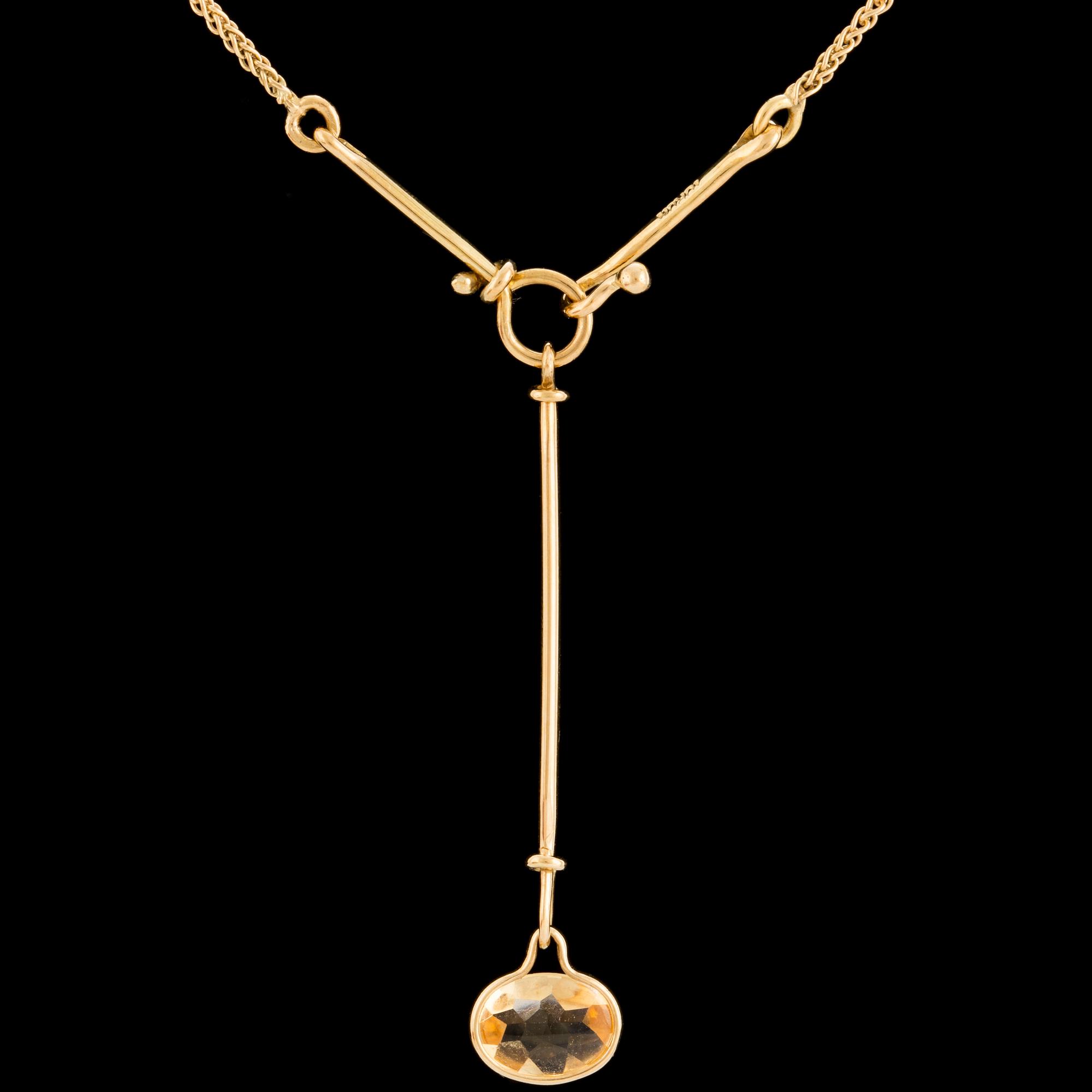 A 'Savannah' pendant set with a faceted citrine by Vivianna Torun Bülow Hübe for Georg Jensen, designed 2006.