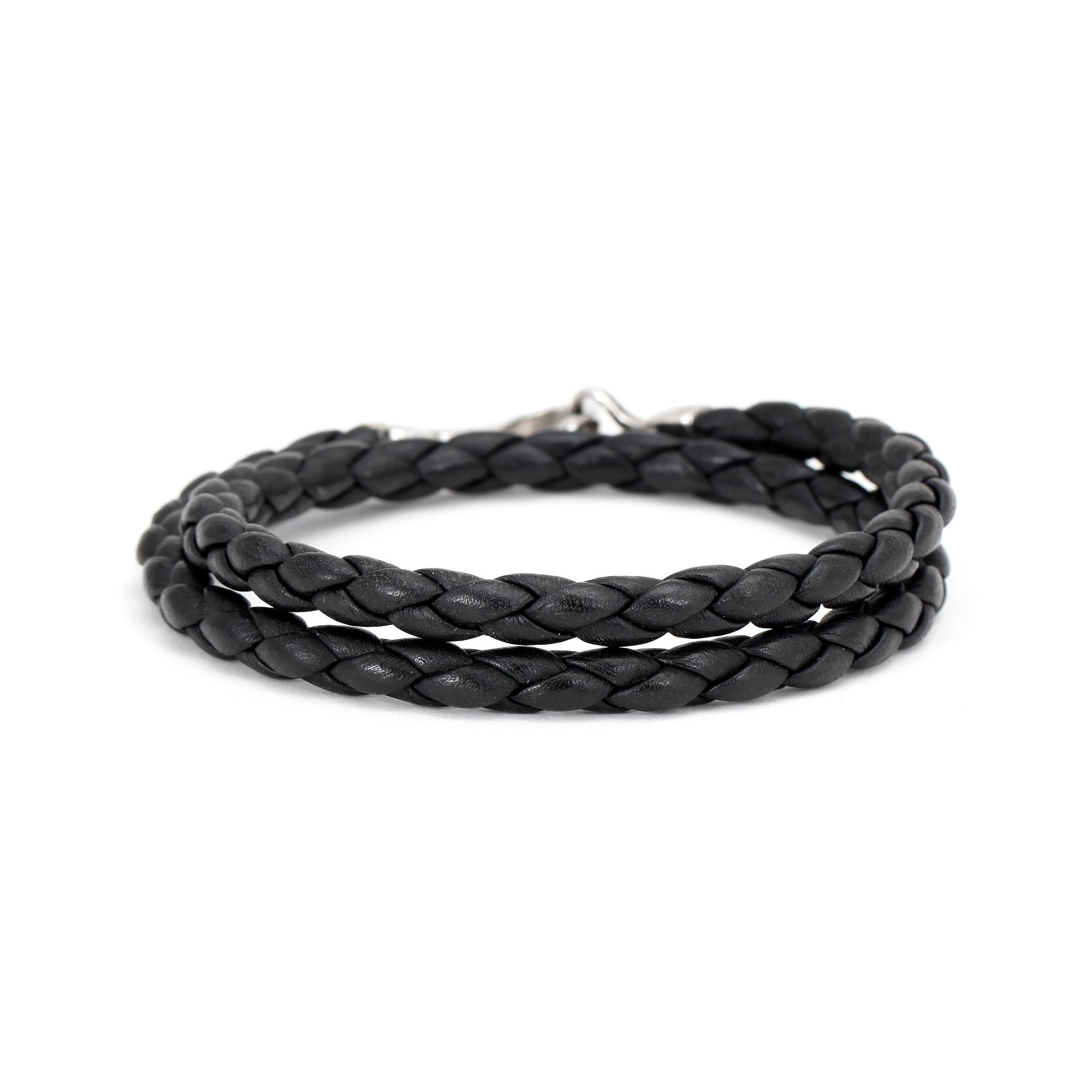 GUCCI. a black leather bracelet.