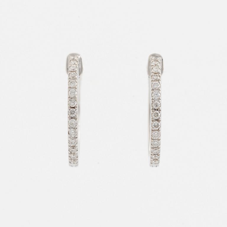 Brilliant cut diamond hoop earrings.