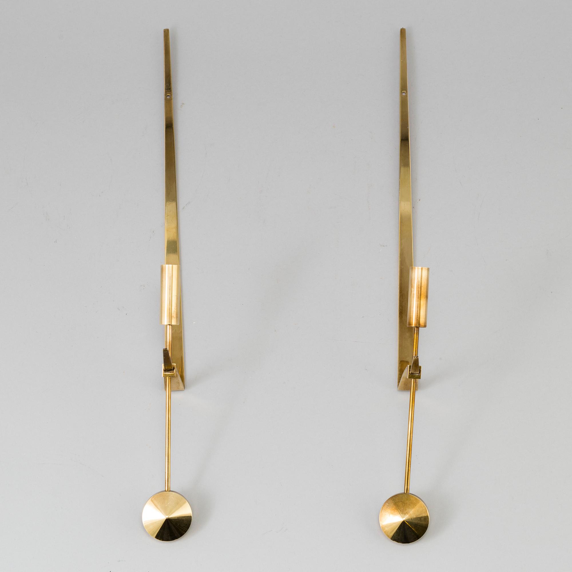 A pair of brass wall candle holders by Pierre Forsell, Skultuna.