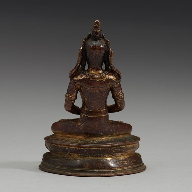 A gilt copper alloy figure of Amitayus, Tibet, 15th Century.