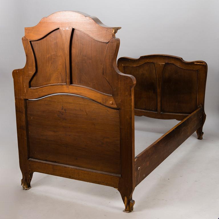 A pair of early 20th Century art nouveau style beds.