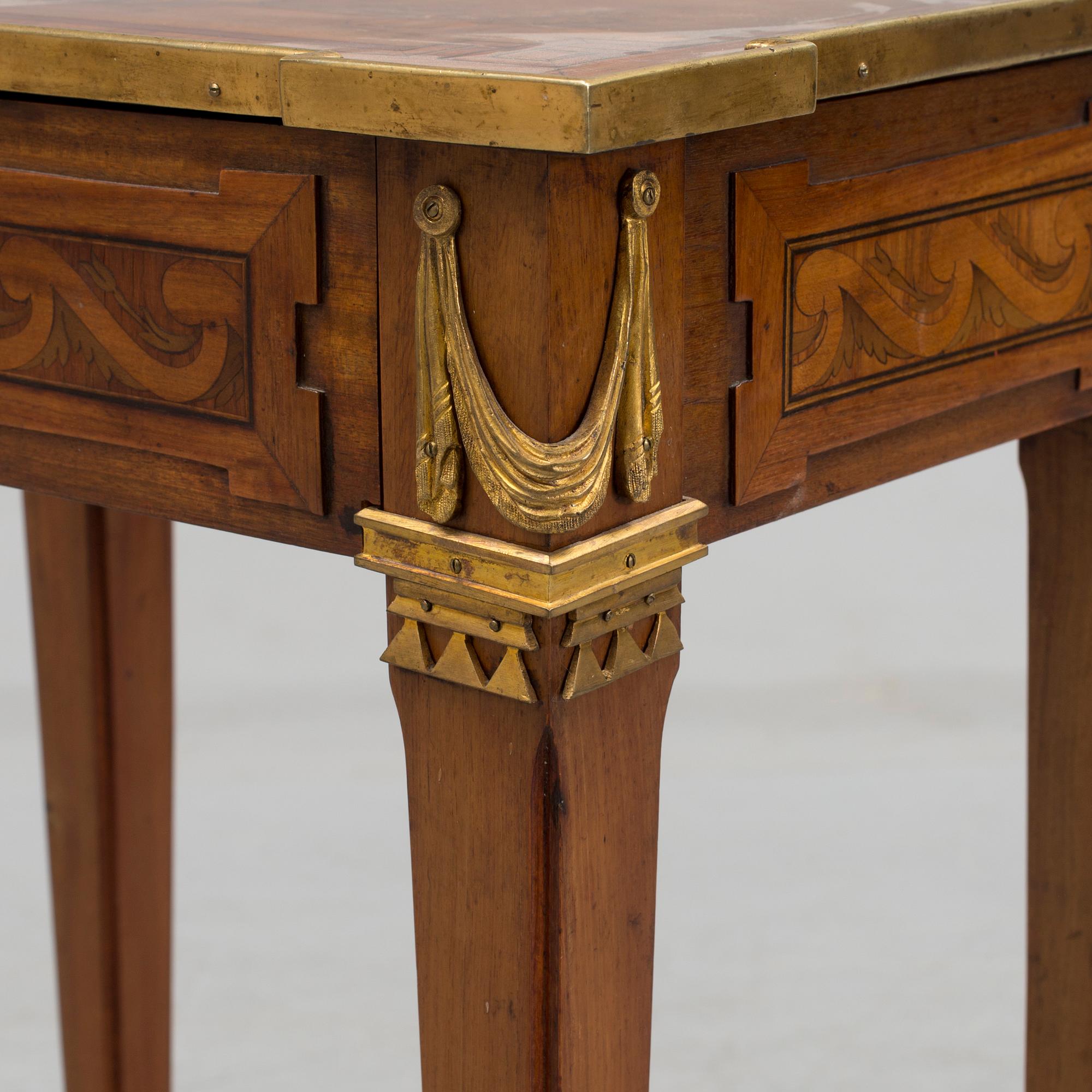 A Louis XVI-style circa 1900 occasional table.