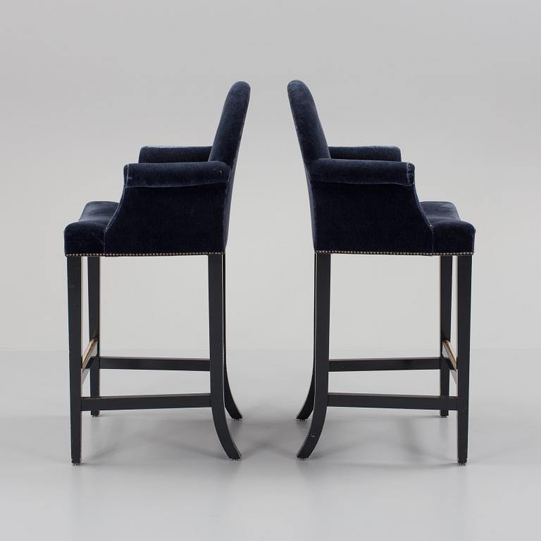 A pair of "The Simplified Moonback Counter Height Stool" barstools by Soane Britain.