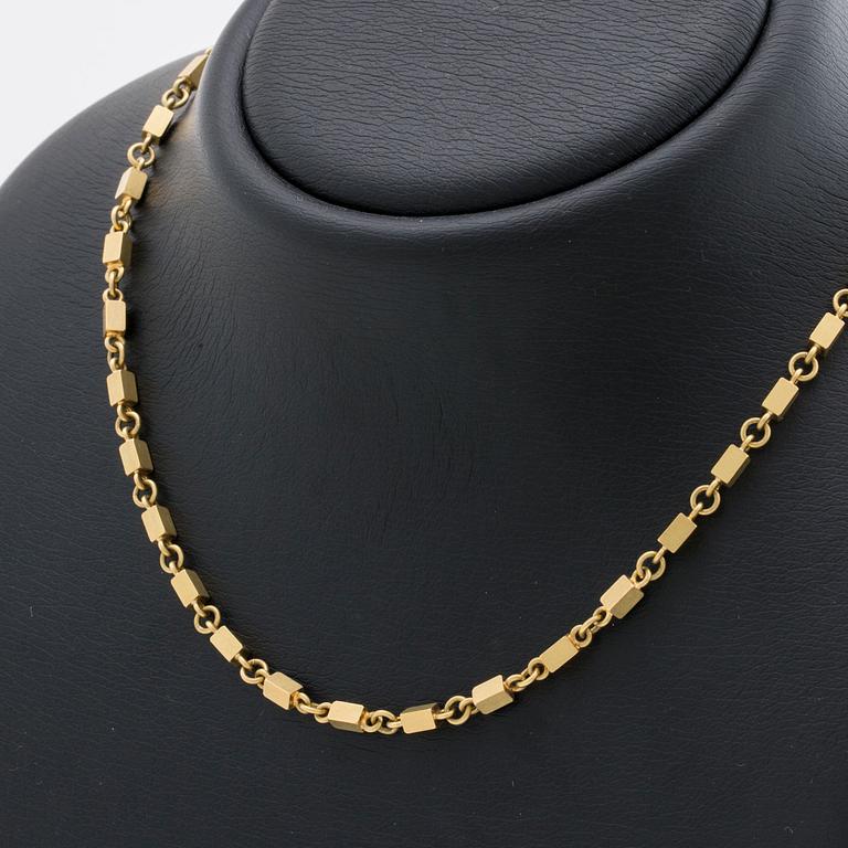 WIWEN NILSSON COLLIER 18K guld mindre stavar och ringar, Lund 1970, original etui.