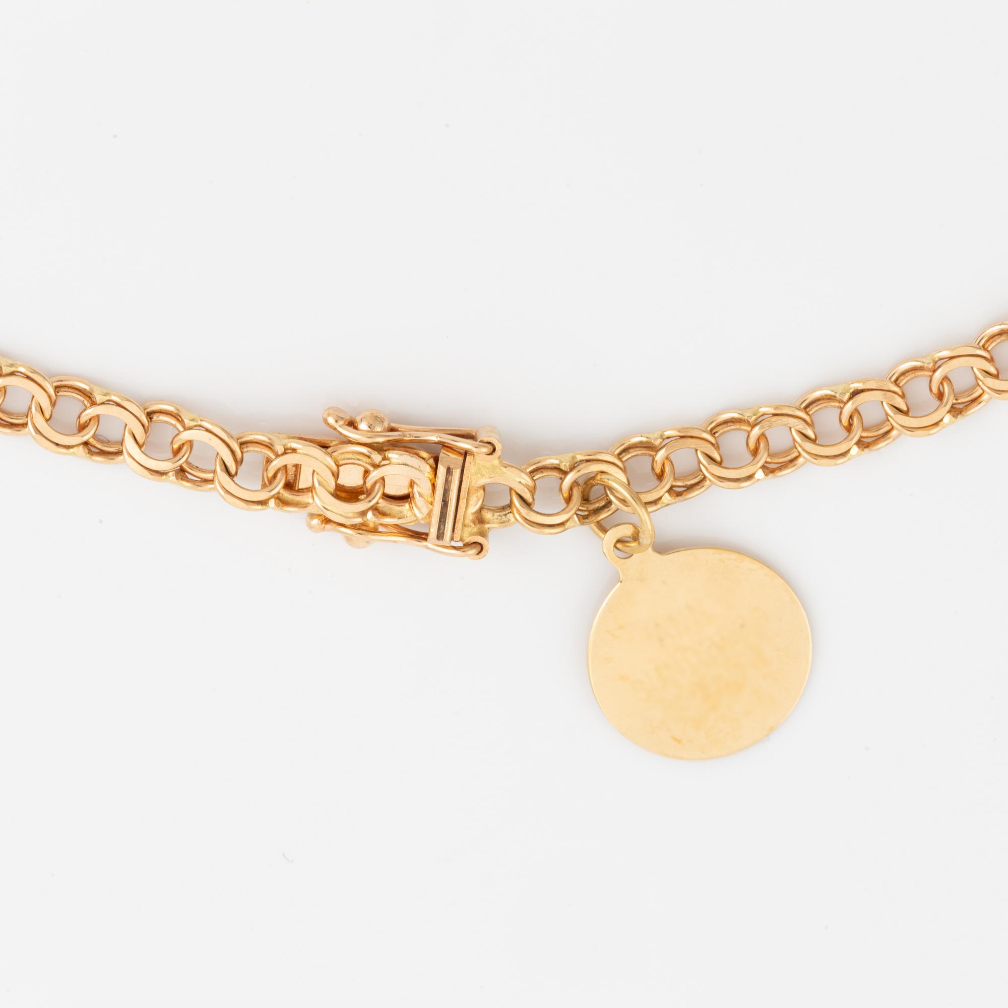 Collier 18K guld, doserad bismarck, med berlock.