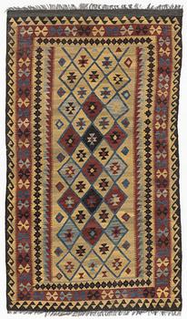 A Kelim rug, c. 250 x 142 cm.