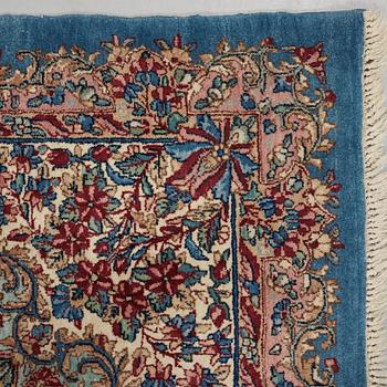 A semi-antique Kerman carpet,  440 x 296 cm.