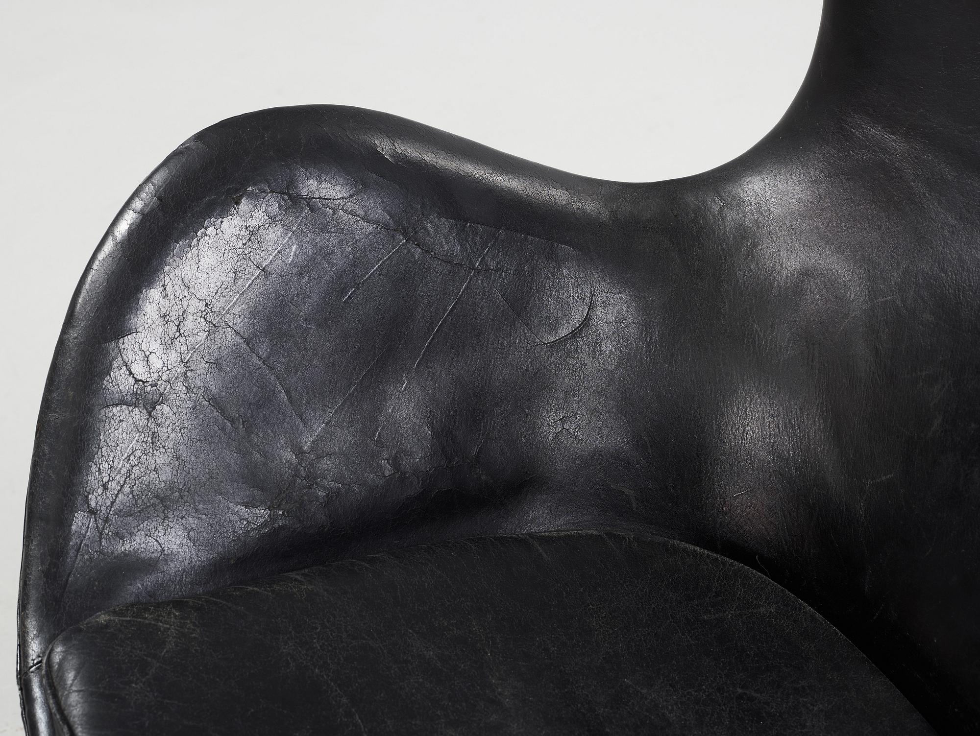 An Arne Jacobsen black leather 'Egg' chair, Fritz Hansen, Denmark 1960's.