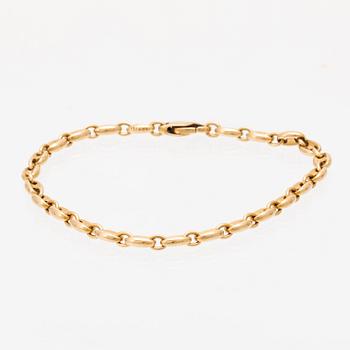 An 18K gold bracelet by Cartier.