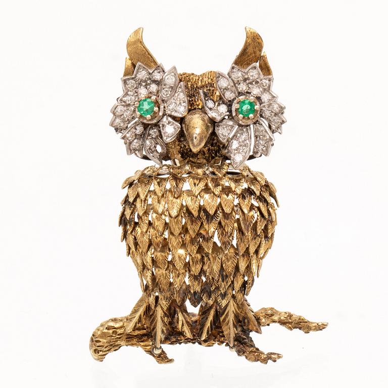 An 14K white and red gold brooch set with single cut diamonds and possibly emeralds.