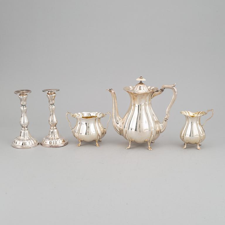 A silver coffee pot, creamer and sugar bowl and a pair of candlesticks, GAB Stockholm 1946 and Dacapo Lidköping 1988.