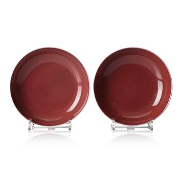 946. A pair of copper-red dishes, Qianlong mark and of the period (1736-95).