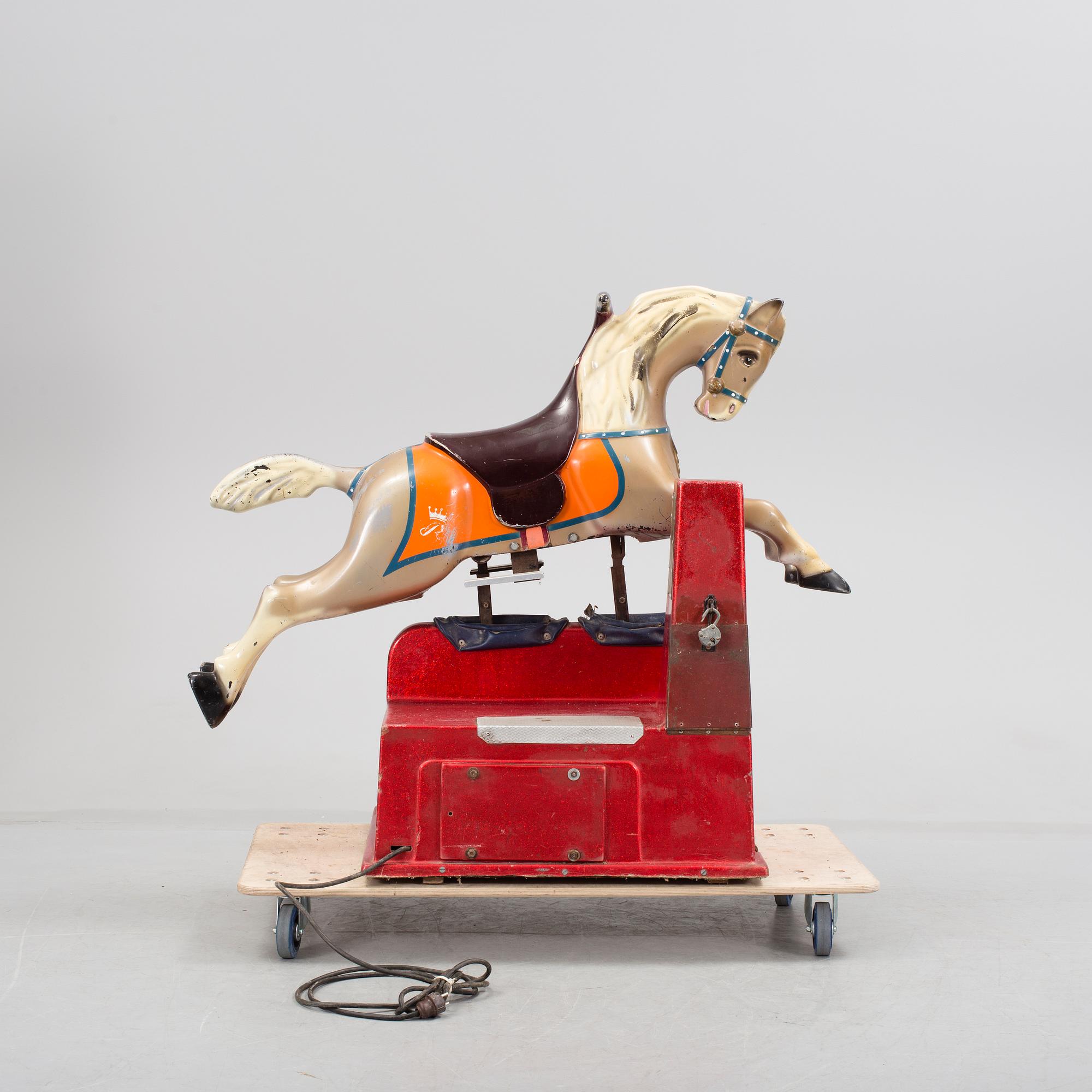 A motorized fiberglass horse probably 1970s.