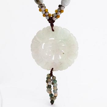 A collier with jade and nyon cord.