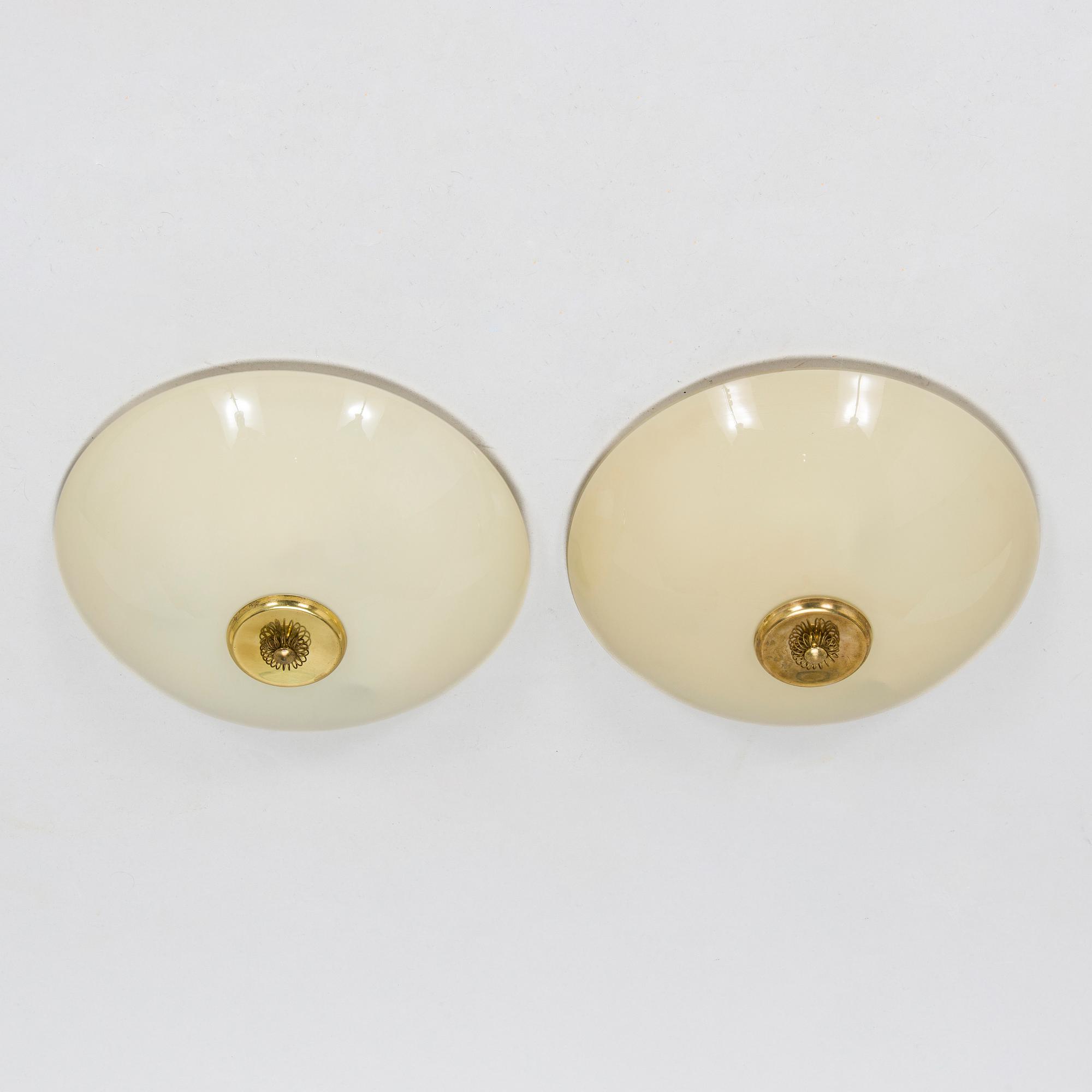 A pair of mid-20th century 'EA 72 ceiling lights for Itsu.