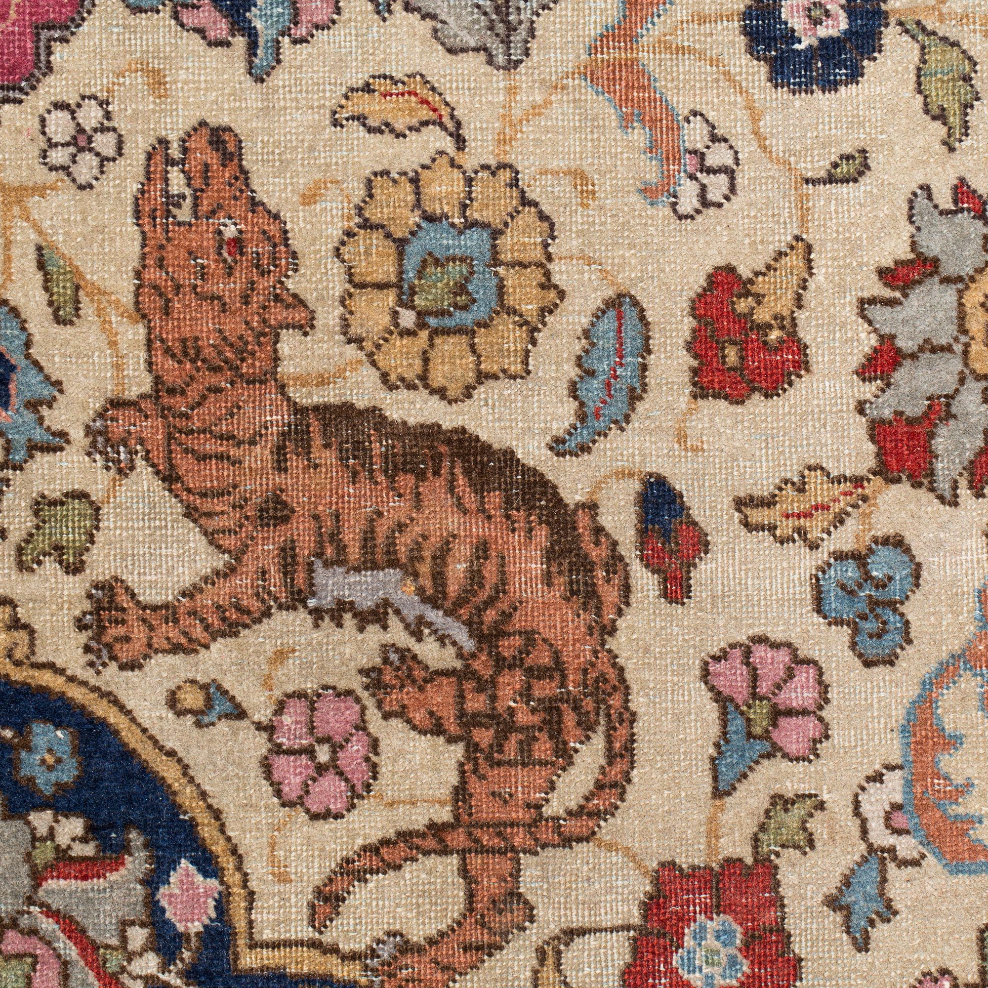 A CARPET, a semi-antique Tabriz, around 422 x 310 cm.