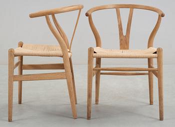 A set of six Hans J Wegner oak 'Wishbone chairs', Carl Hansen & Søn, Denmark.