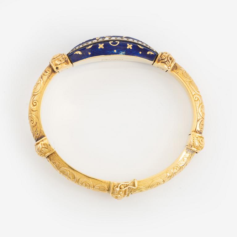 A bangle, gold, blue enamel, and rose cut diamonds.