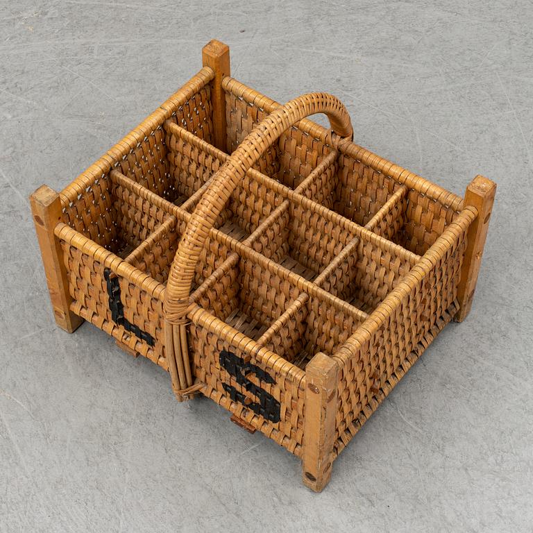A rattan bottle basket.