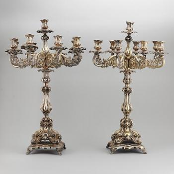 A pair of barocque style nine lights candelabra, silver plate, 20th Century.