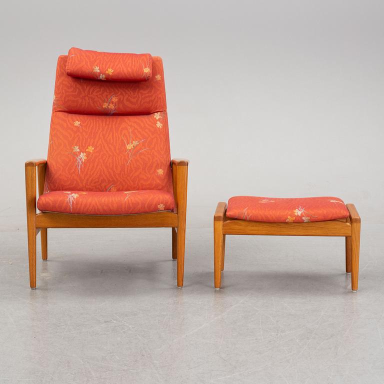 A 1950's/60's lounge chair and foot stool.