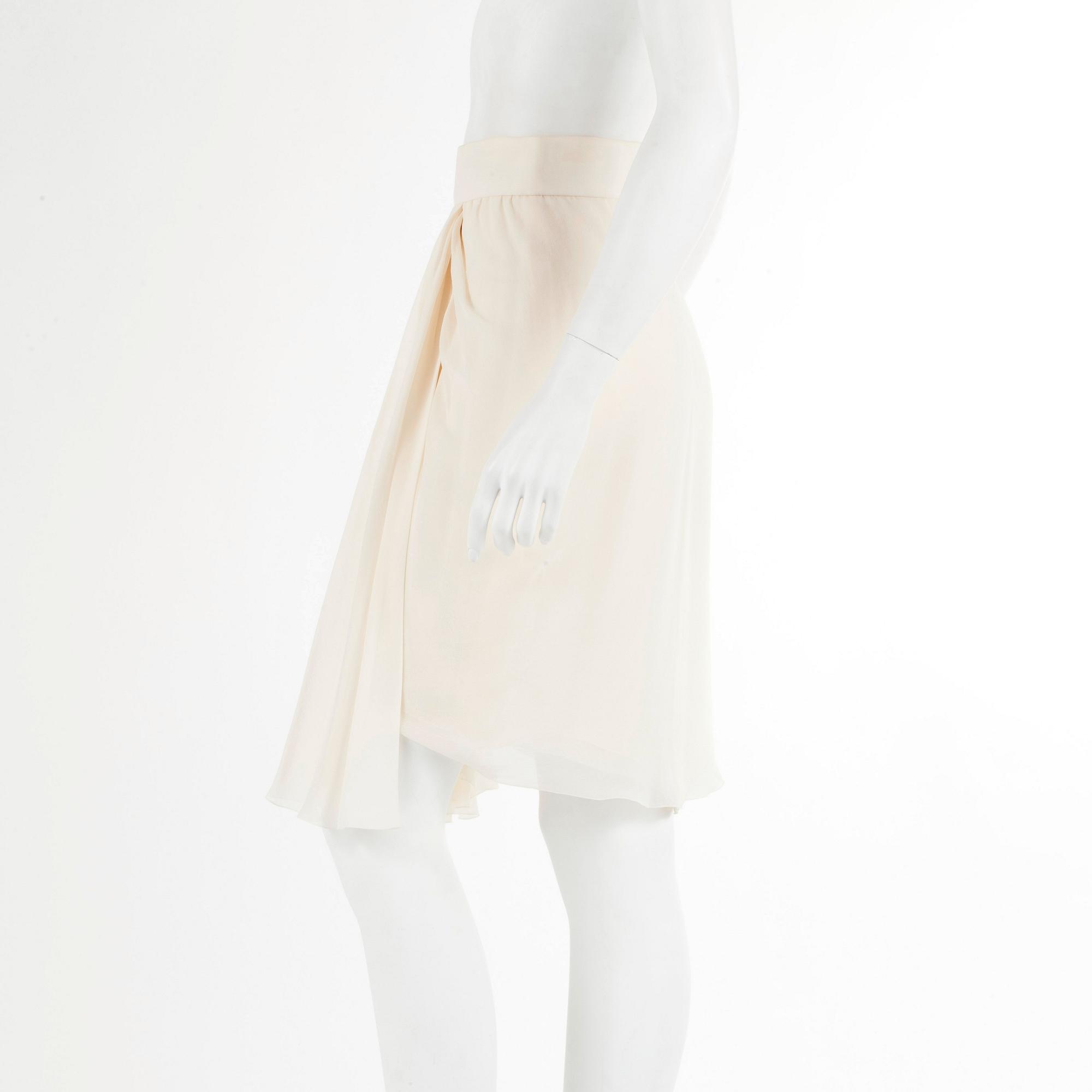 CHANEL, a bonewhite silk skirt. French size 40.