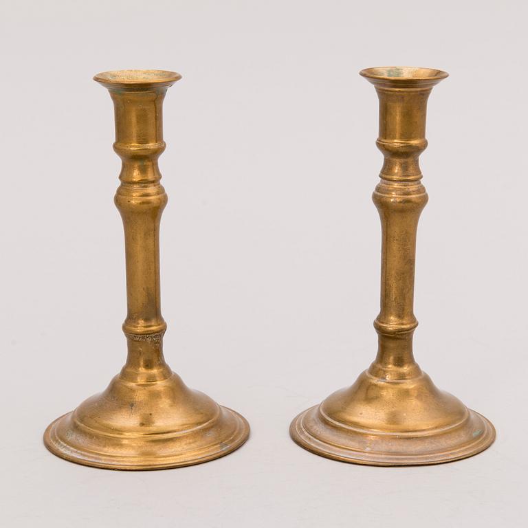 Set of ten 19th/20th Century brass and wood candlesticks.