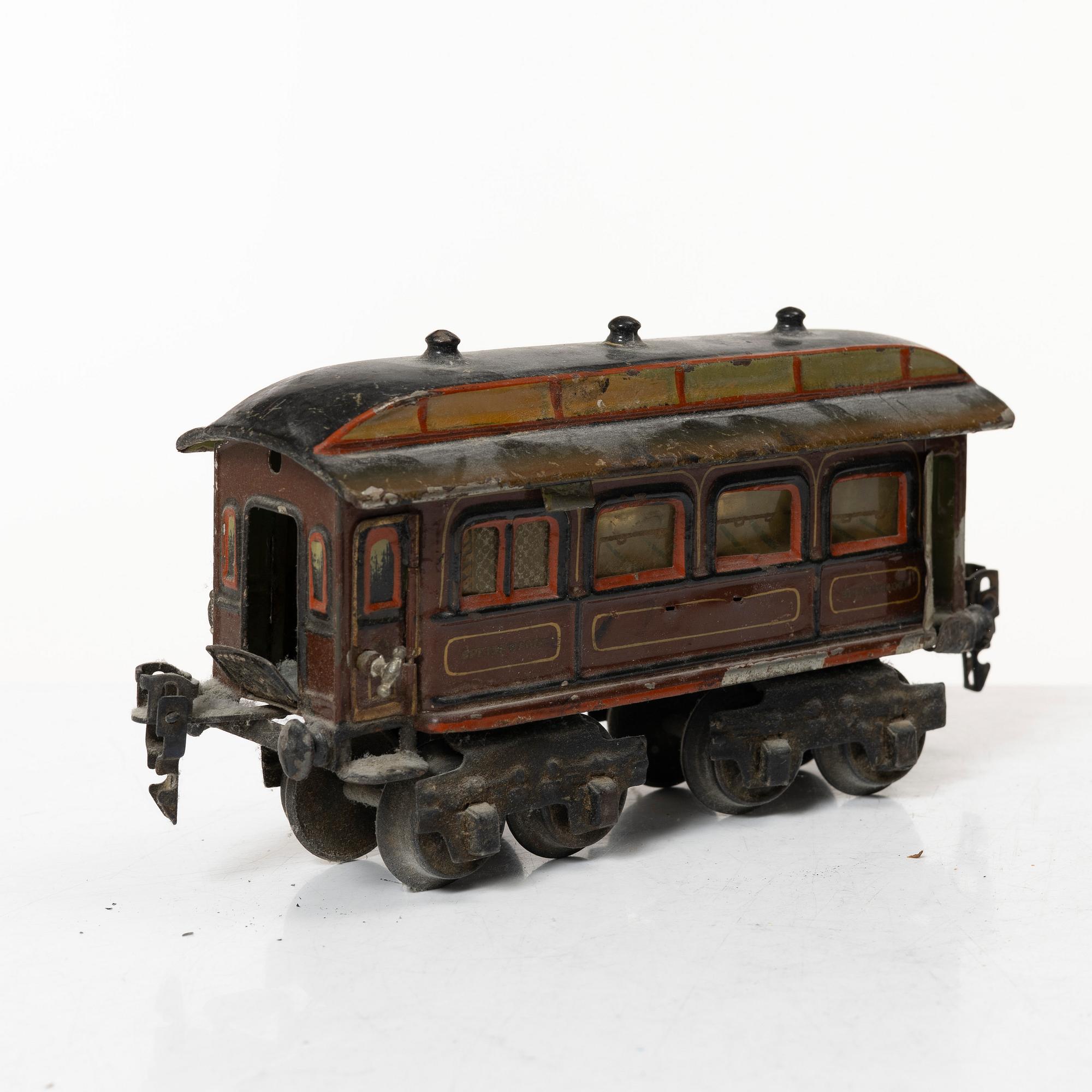 Model train with track and station building, 13 pieces, Germany, 1920s.