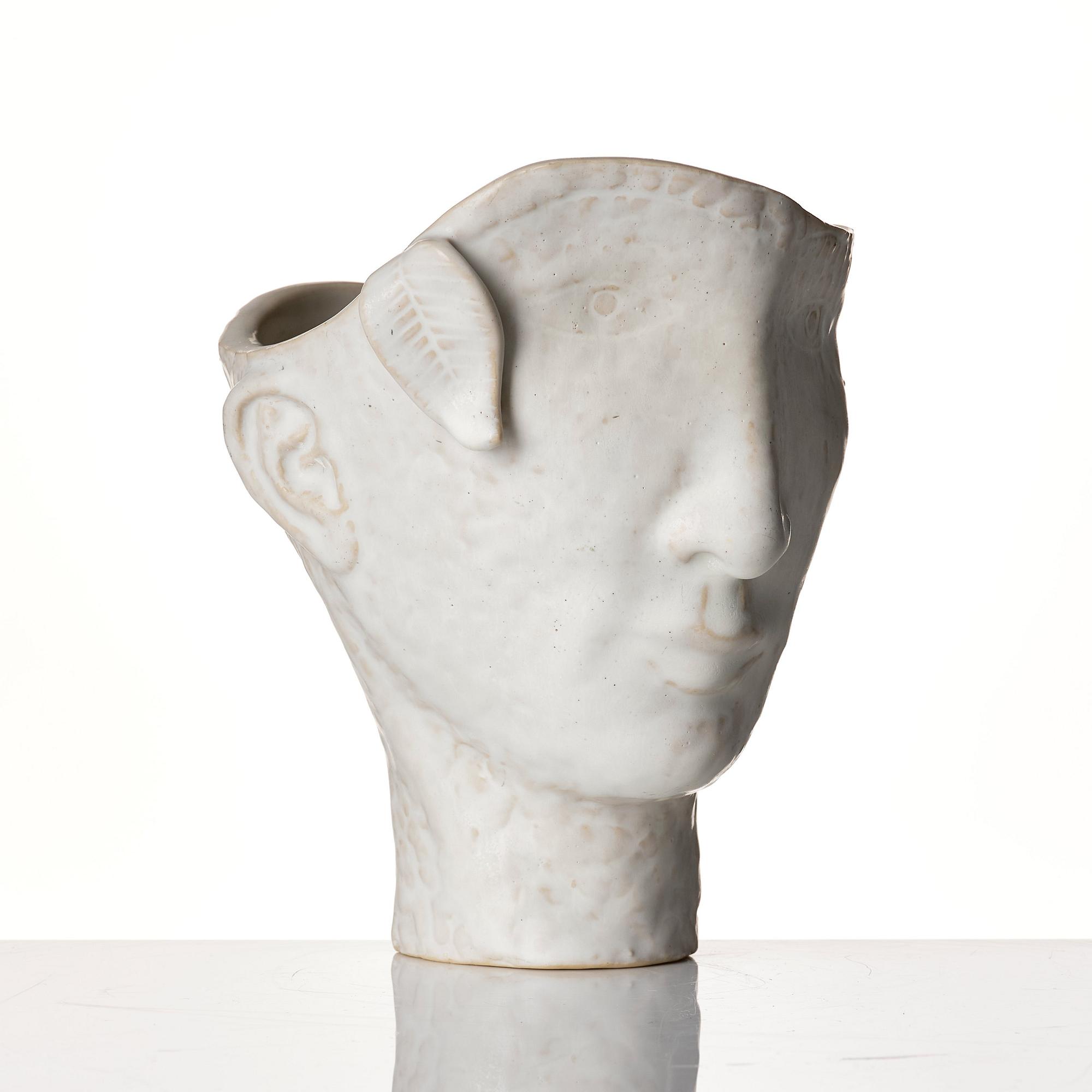 Stig Lindberg, a white glazed stoneware vase of a head, Gustavsberg Studio, probably 1940s.