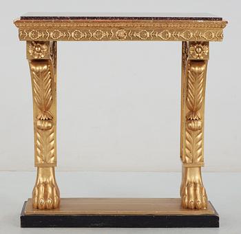 A Swedish Empire 19th century console table with porphyry top.