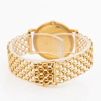 Rolex, 18K gold, with an 18K gold bracelet, wristwatch, 31.5 mm.