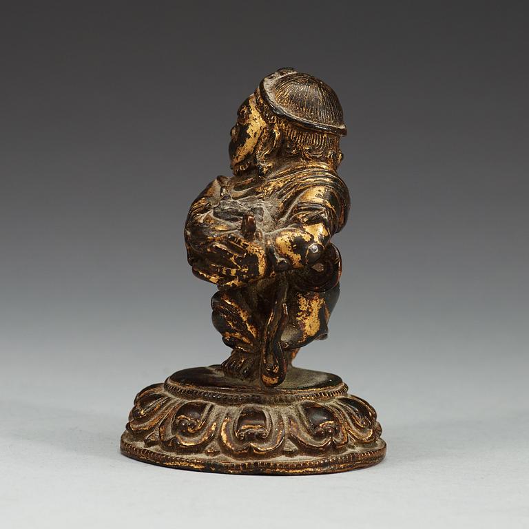 A gilt bronze figure of a guardsman, Qing dynasty (1644-1912).